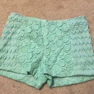Green embroidered shorts